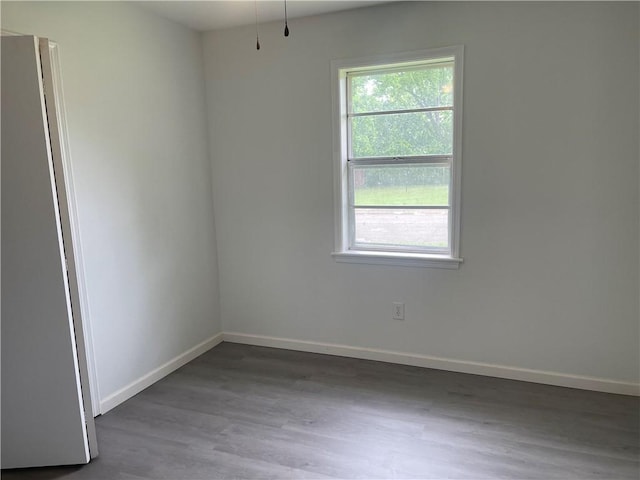401 Walnut St, Clarksville, AR 72830 - empty room featuring wood finished floors and baseboards