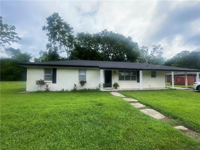 401 Walnut St, Clarksville, AR 72830 - ranch-style home featuring a front yard and brick siding