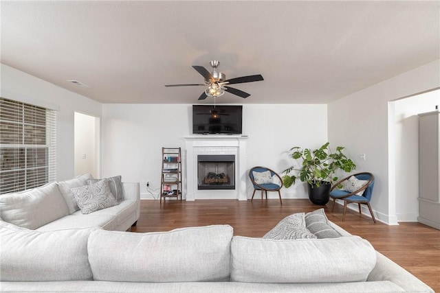 2758 Suncrest Ave, Springdale, AR 72764 - living room with wood finished floors, a fireplace, baseboards, and ceiling fan