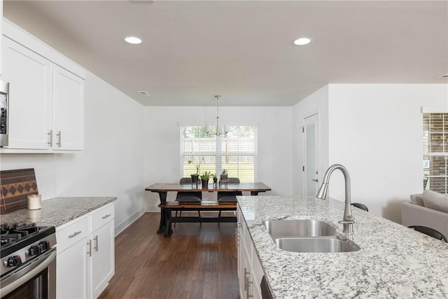 2758 Suncrest Ave, Springdale, AR 72764 - kitchen with a sink, dark wood finished floors, light stone countertops, decorative backsplash, and recessed lighting