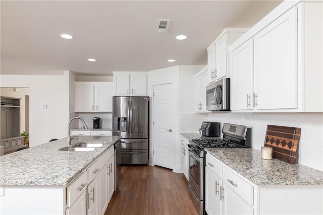 2758 Suncrest Ave, Springdale, AR 72764 - kitchen with appliances with stainless steel finishes, a sink, white cabinetry, backsplash, and recessed lighting