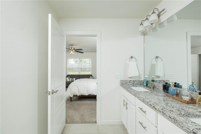2758 Suncrest Ave, Springdale, AR 72764 - bathroom with connected bathroom, tile patterned floors, double vanity, and baseboards