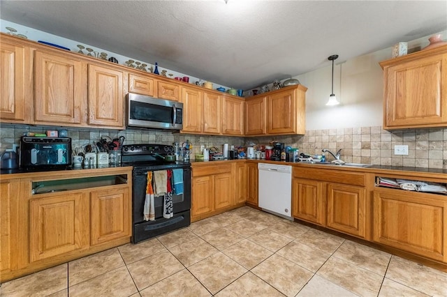 1329 Homestead Ln, West Fork, AR 72774 - kitchen featuring stainless steel microwave, electric range, dishwasher, a sink, and tasteful backsplash