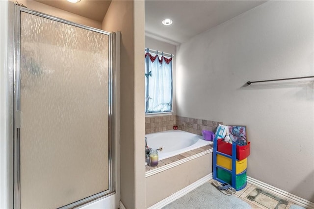 1329 Homestead Ln, West Fork, AR 72774 - full bath featuring a stall shower, a garden tub, and baseboards