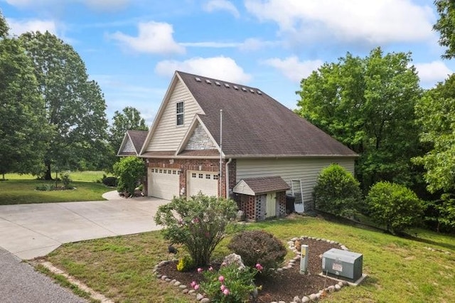 1878 Morning Side Falls Blvd, Blue Eye, MO 65611 - view of home's exterior with a lawn, concrete driveway, brick siding, and a garage