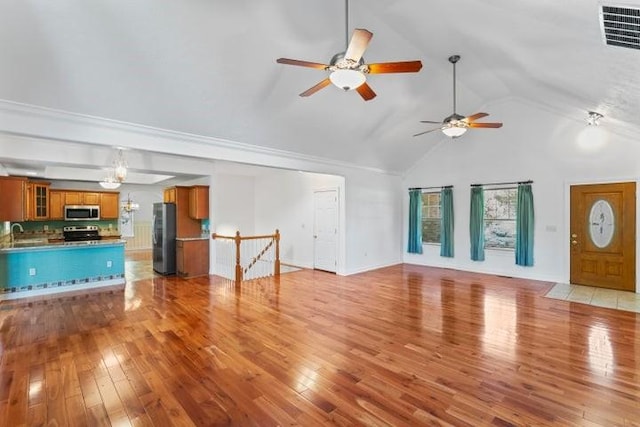 1878 Morning Side Falls Blvd, Blue Eye, MO 65611 - unfurnished living room with ceiling fan, light wood finished floors, high vaulted ceiling, and a sink