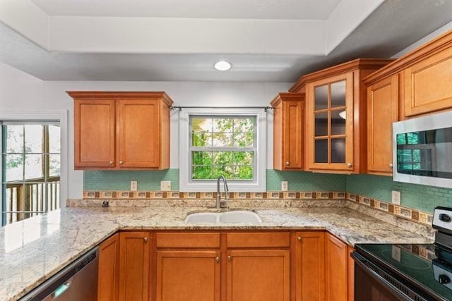 1878 Morning Side Falls Blvd, Blue Eye, MO 65611 - kitchen with appliances with stainless steel finishes, a sink, light stone countertops, and glass insert cabinets