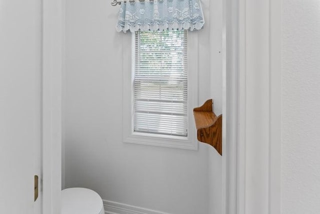 1878 Morning Side Falls Blvd, Blue Eye, MO 65611 - bathroom featuring baseboards and toilet