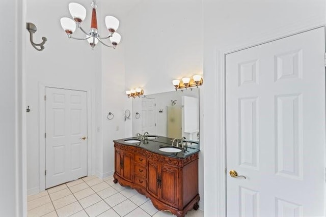 1878 Morning Side Falls Blvd, Blue Eye, MO 65611 - full bathroom featuring tile patterned floors, a chandelier, double vanity, and a shower with shower door