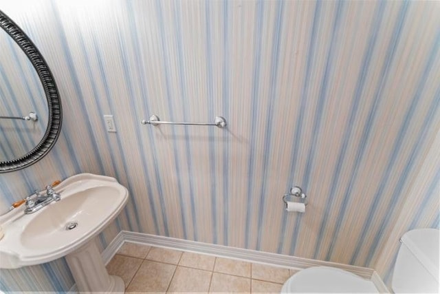 1878 Morning Side Falls Blvd, Blue Eye, MO 65611 - half bathroom with toilet, baseboards, tile patterned floors, and wallpapered walls