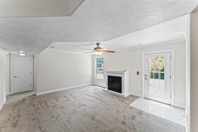 1878 Morning Side Falls Blvd, Blue Eye, MO 65611 - unfurnished living room featuring carpet, a ceiling fan, plenty of natural light, a fireplace, and a textured ceiling