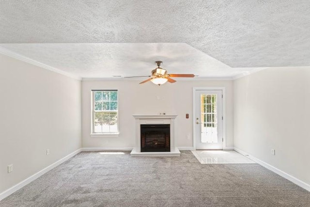1878 Morning Side Falls Blvd, Blue Eye, MO 65611 - unfurnished living room featuring crown molding, a fireplace with raised hearth, ceiling fan, a textured ceiling, and carpet flooring