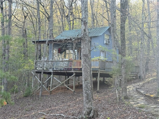1088 Little Red River Rd, Leslie, AR 72645 - view of front of property with metal roof, a deck, and a view of trees