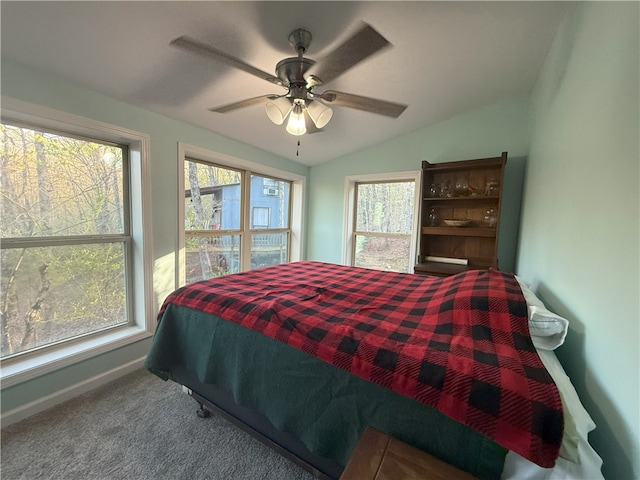 1088 Little Red River Rd, Leslie, AR 72645 - carpeted bedroom with multiple windows, lofted ceiling, baseboards, and ceiling fan