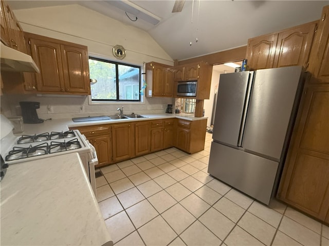 1088 Little Red River Rd, Leslie, AR 72645 - kitchen with appliances with stainless steel finishes, under cabinet range hood, a sink, lofted ceiling, and light tile patterned floors