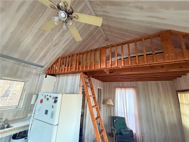 1088 Little Red River Rd, Leslie, AR 72645 - kitchen with freestanding refrigerator, a sink, a ceiling fan, vaulted ceiling, and wood walls
