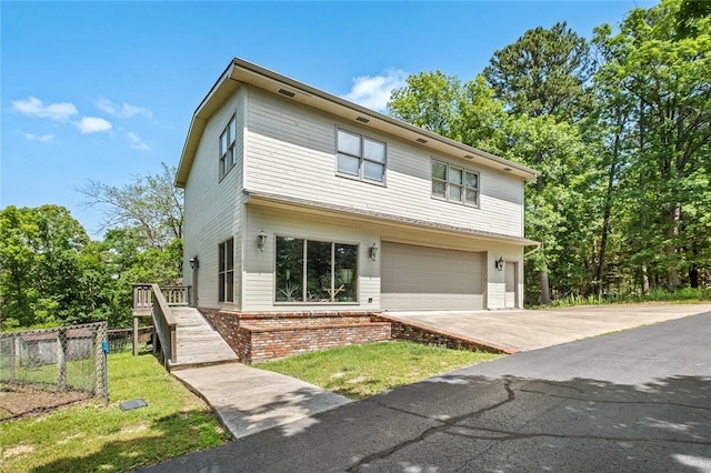 24 Dogwood Rdg, Eureka Springs, AR 72632 - view of front of home with an attached garage, fence, concrete driveway, and a deck