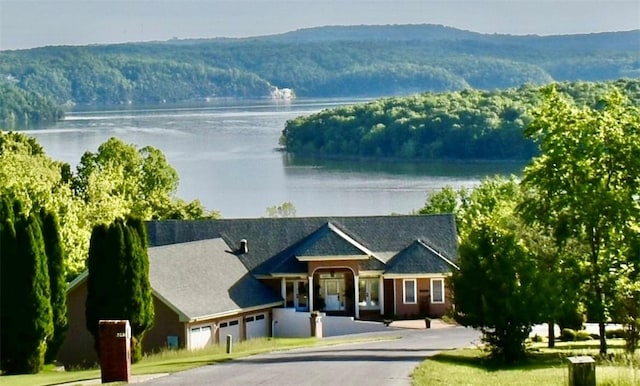 8141 Ward Ln, Rogers, AR 72756 - view of front of house featuring a water and mountain view and curved driveway