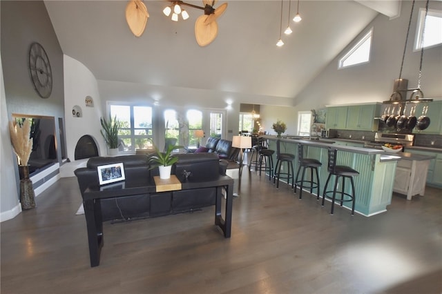 8141 Ward Ln, Rogers, AR 72756 - living room with high vaulted ceiling, a chandelier, and dark wood-style flooring