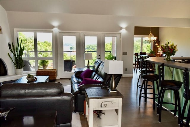8141 Ward Ln, Rogers, AR 72756 - living area with a chandelier, baseboards, dark wood-style flooring, and french doors