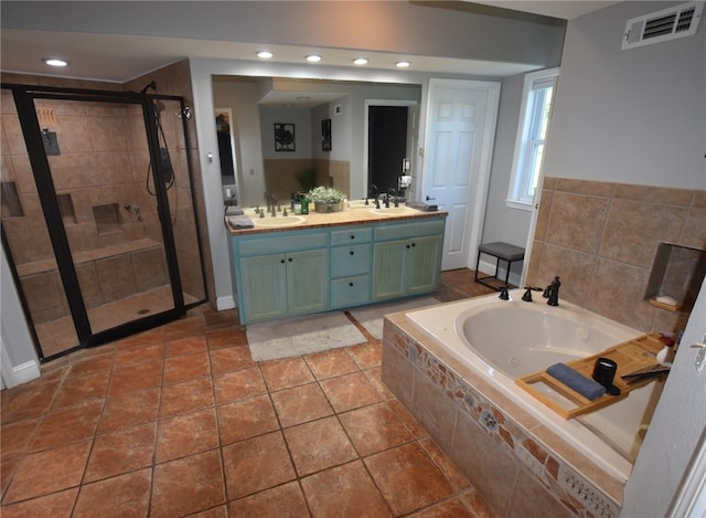 8141 Ward Ln, Rogers, AR 72756 - bathroom featuring a tub with jets, double vanity, a shower stall, and recessed lighting