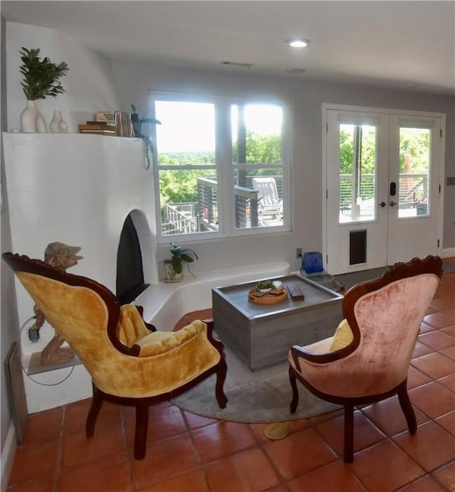 8141 Ward Ln, Rogers, AR 72756 - sitting room featuring plenty of natural light, tile patterned floors, french doors, recessed lighting, and baseboards