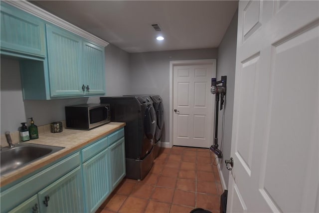 8141 Ward Ln, Rogers, AR 72756 - laundry room with washing machine and dryer, cabinet space, recessed lighting, dark tile patterned flooring, and baseboards