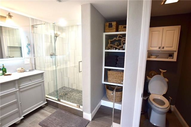 8141 Ward Ln, Rogers, AR 72756 - bathroom with a stall shower, vanity, toilet, and baseboards