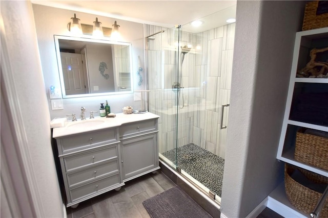 8141 Ward Ln, Rogers, AR 72756 - full bath with vanity, a shower stall, wood finished floors, and recessed lighting