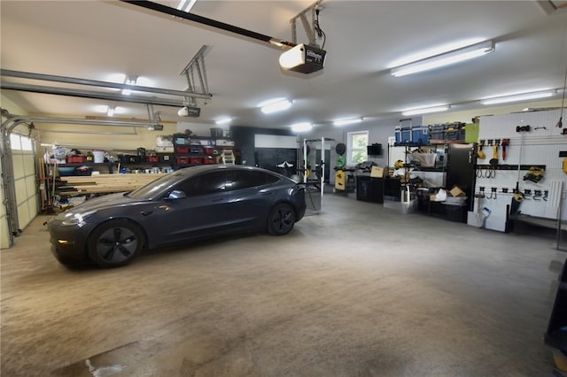 8141 Ward Ln, Rogers, AR 72756 - garage with a workshop area and a garage door opener