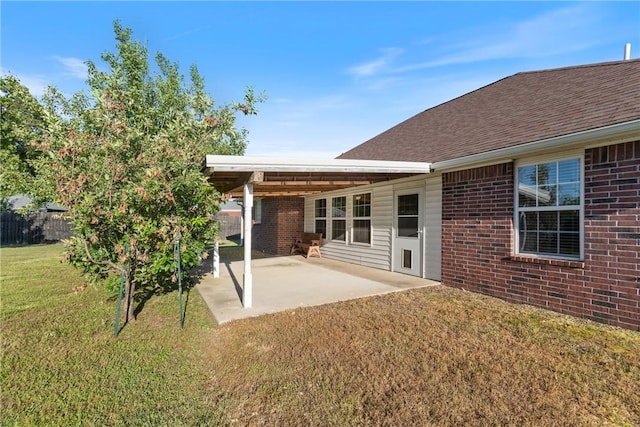 708 Carter Ct, Siloam Springs, AR 72761 - rear view of property featuring brick siding, a patio, and roof with shingles