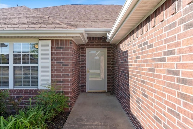 708 Carter Ct, Siloam Springs, AR 72761 - property entrance with a shingled roof and brick siding