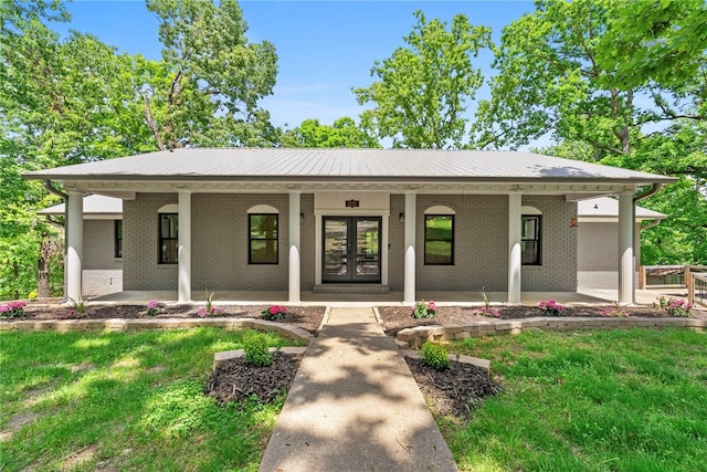 15145 Beech Dr, Lowell, AR 72745 - ranch-style home with french doors, a porch, brick siding, and a front lawn