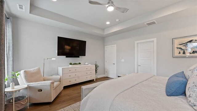 1404 Breeze Ct, Bentonville, AR 72713 - bedroom featuring wood finished floors, recessed lighting, a raised ceiling, ceiling fan, and baseboards
