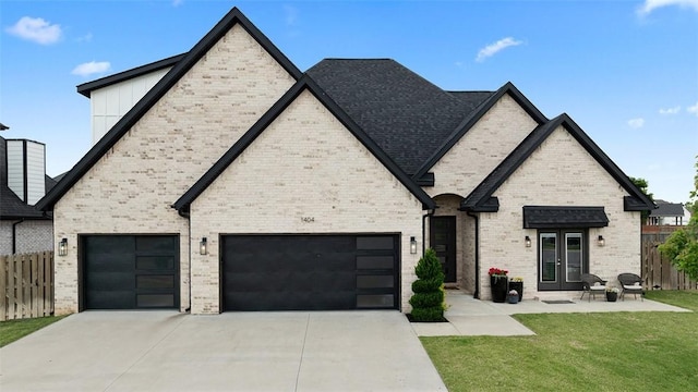 1404 Breeze Ct, Bentonville, AR 72713 - french country home with french doors, driveway, brick siding, board and batten siding, and an attached garage