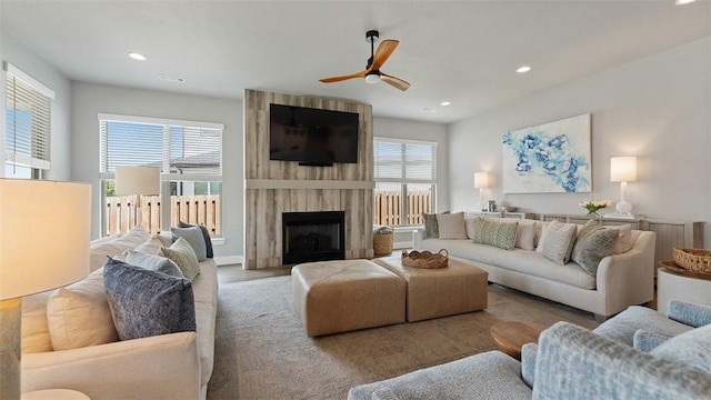 1404 Breeze Ct, Bentonville, AR 72713 - living room with a ceiling fan, recessed lighting, a fireplace, and wood finished floors