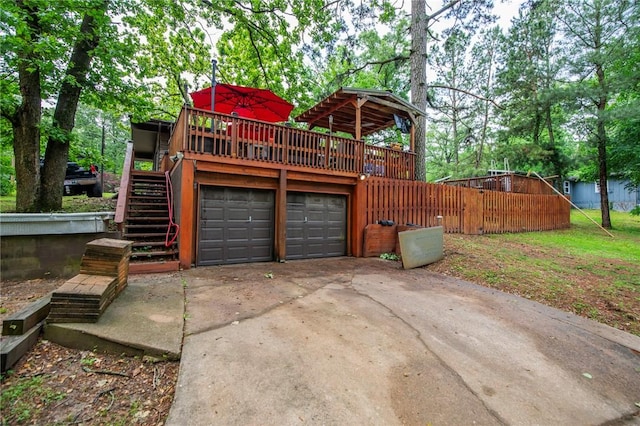 3 Rader Ln, Bella Vista, AR 72714 - garage with concrete driveway and view of wooded area