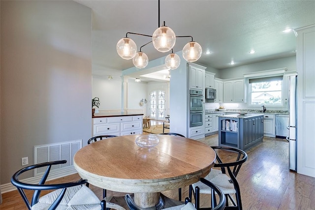 2507 NW Linebarger Ln, Bentonville, AR 72712 - dining area with plenty of natural light, light wood-style floors, baseboards, and recessed lighting