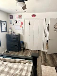 410 E Harvard St, Siloam Springs, AR 72761 - bedroom featuring wood finished floors, a closet, a ceiling fan, and baseboards