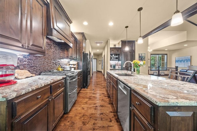 4218 Homewoods Dr, Little Flock, AR 72756 - kitchen featuring stainless steel appliances, dark wood-style flooring, a sink, dark brown cabinets, and recessed lighting