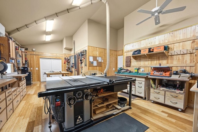 4218 Homewoods Dr, Little Flock, AR 72756 - garage with wooden walls, a ceiling fan, a workshop area, and a wainscoted wall