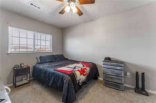 3408 SW Victoria Pl, Bentonville, AR 72712 - carpeted bedroom with a textured ceiling, a ceiling fan, and baseboards