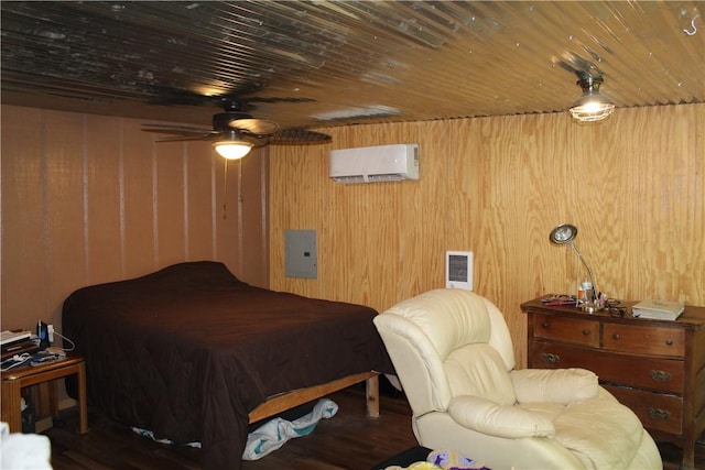 1739 Mc 6070, Flippin, AR 72634 - bedroom with a wall unit AC, electric panel, wood walls, and wood finished floors