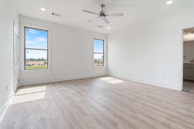 6601 SW Acacia St, Bentonville, AR 72713 - spare room with plenty of natural light, recessed lighting, light wood-style floors, and baseboards