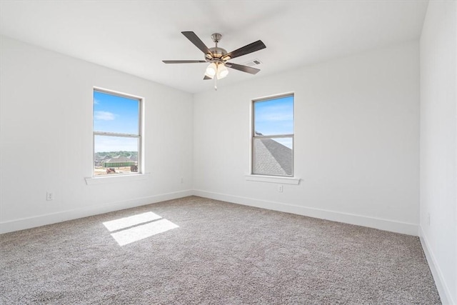6601 SW Acacia St, Bentonville, AR 72713 - empty room with plenty of natural light, carpet, baseboards, and ceiling fan