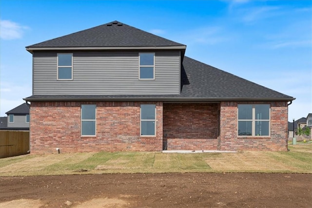 6601 SW Acacia St, Bentonville, AR 72713 - back of property with brick siding and roof with shingles
