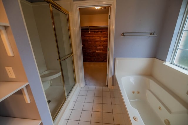 4509 W Highland Knolls Rd, Rogers, AR 72758 - bathroom featuring tile patterned floors, a stall shower, a whirlpool tub, and a walk in closet