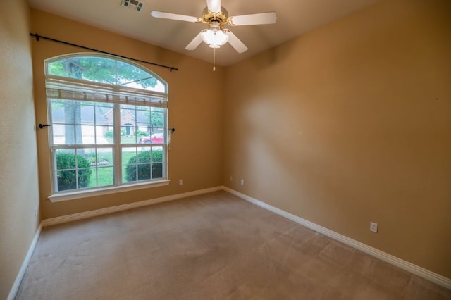4509 W Highland Knolls Rd, Rogers, AR 72758 - spare room featuring light colored carpet, baseboards, and ceiling fan