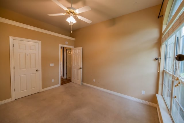 4509 W Highland Knolls Rd, Rogers, AR 72758 - unfurnished bedroom featuring carpet floors, baseboards, and ceiling fan