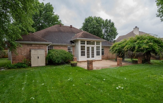 4509 W Highland Knolls Rd, Rogers, AR 72758 - back of house featuring brick siding, french doors, a patio, and a lawn
